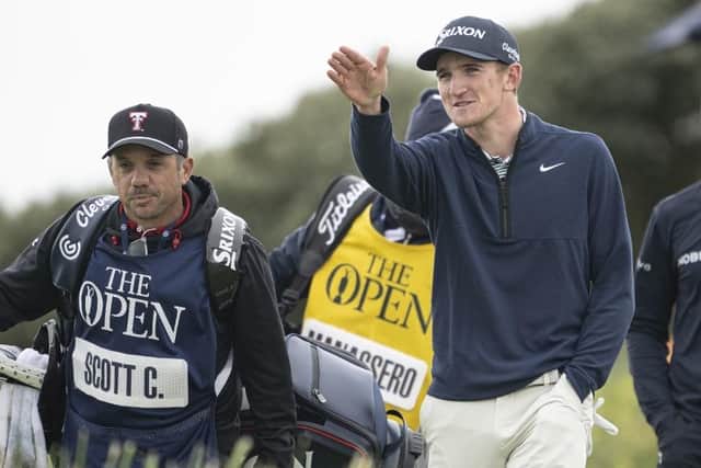 Calum Scott points something out to his caddie, James Vargas, during the final round of the 152nd Open at Royal Troon. Picture: Tom Russo/The Scotsman
