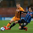 Greg Docherty of Hull City is tackled by Matty Lund of Rochdale during the Sky Bet League One match  on October 17, 2020. (Photo by Lewis Storey/Getty Images)