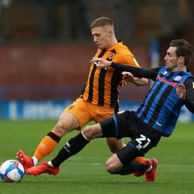 Greg Docherty of Hull City is tackled by Matty Lund of Rochdale during the Sky Bet League One match  on October 17, 2020. (Photo by Lewis Storey/Getty Images)