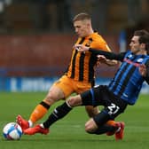 Greg Docherty of Hull City is tackled by Matty Lund of Rochdale during the Sky Bet League One match  on October 17, 2020. (Photo by Lewis Storey/Getty Images)