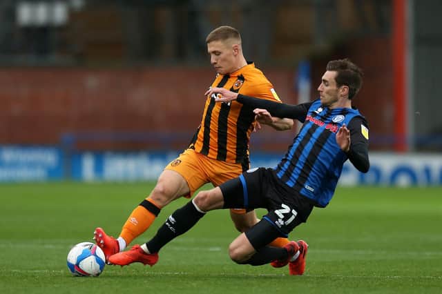 Greg Docherty of Hull City is tackled by Matty Lund of Rochdale during the Sky Bet League One match on October 17, 2020. (Photo by Lewis Storey/Getty Images)