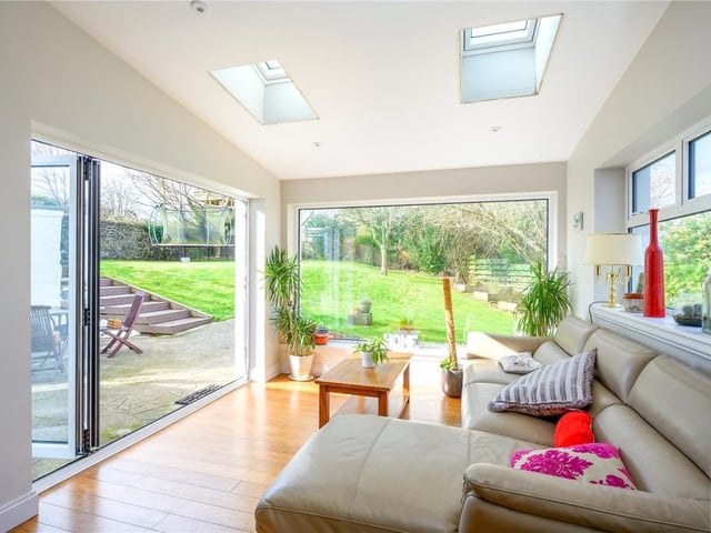 The sunroom has bi-folding doors out to the garden.