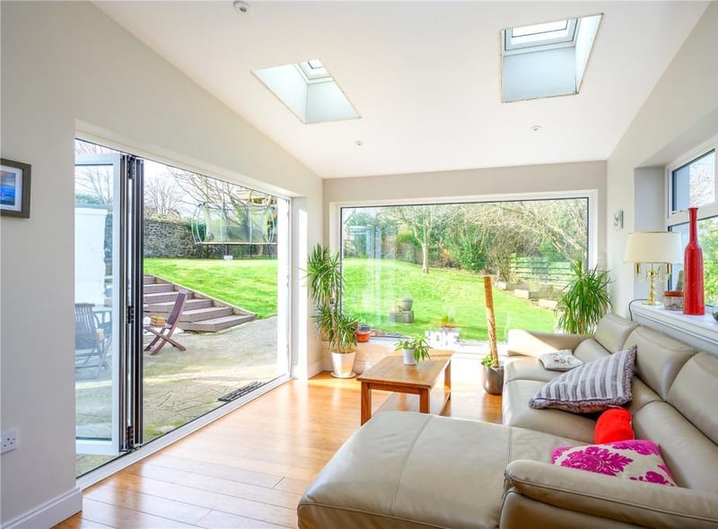 The sunroom has bi-folding doors out to the garden.