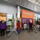 Shoppers queue outside a branch of Sainsbury's during the first lockdown in March 2020. Picture: Dan Mullan/Getty Images