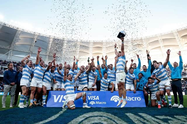 Argentina celebrate with the Visa Macro Cup after the Test series win over Scotland. (Photo by Pablo Gasparini / AFP)