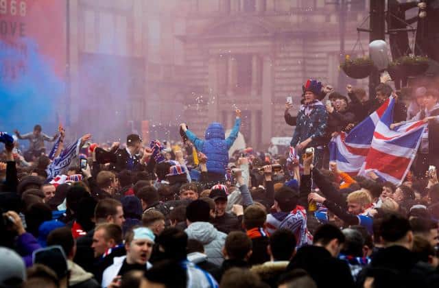 Rangers fans celebrating at George Square in Glasgow on Sunday after the Ibrox club's Premiership title win was confirmed. (Photo by Craig Foy / SNS Group)