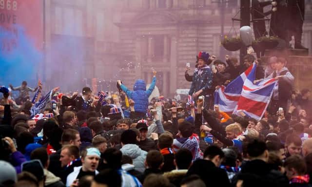 Rangers fans celebrating at George Square in Glasgow on Sunday after the Ibrox club's Premiership title win was confirmed. (Photo by Craig Foy / SNS Group)