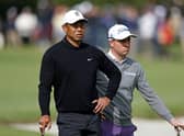 Tiger Woods and Justin Thomas wait to putt on the first green during the second round of the The Genesis Invitational at Riviera Country Club in Pacific Palisades, California. Picture: Michael Owens/Getty Images.