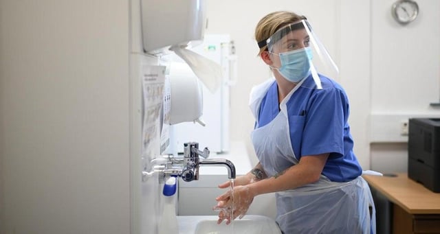 Operations across Edinburgh are being postponed because of the pressure caused by increasing numbers of patients and staff infected with coronavirus.