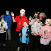 Lauren Sinclair (red T-shirt), founder of the Worldwide Santa's Christmas Eve Jingle Facebook page, took part in the event with family, friends and neighbours. Picture: Michael Gillen.