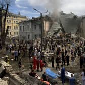 Rescuers clear the rubble of the destroyed Ohmatdyt Children's Hospital following a missile attack in Kyiv