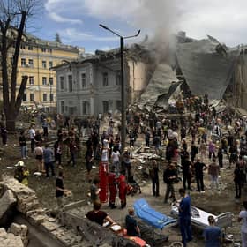 Rescuers clear the rubble of the destroyed Ohmatdyt Children's Hospital following a missile attack in Kyiv