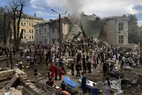 Rescuers clear the rubble of the destroyed Ohmatdyt Children's Hospital following a missile attack in Kyiv
