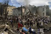 Rescuers clear the rubble of the destroyed Ohmatdyt Children's Hospital following a missile attack in Kyiv
