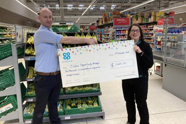 Daryl Black, Store Manager at Ballater Co-op with Maggie Mackay from Crathie Opportunity Holidays