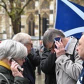 Scottish independence supporters outside the Supreme Court in London listen to the referendum ruling being delivered (Picture: Justin Tallis/AFP via Getty Images)