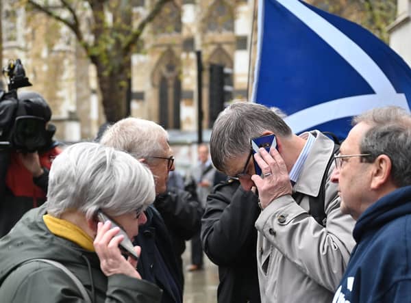Scottish independence supporters outside the Supreme Court in London listen to the referendum ruling being delivered (Picture: Justin Tallis/AFP via Getty Images)