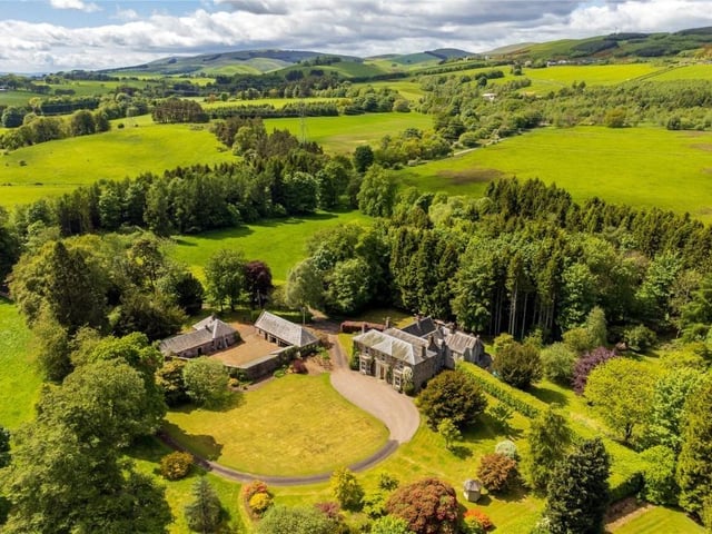Aerial view showing beautiful countryside setting.