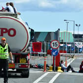 Climate change protesters, This Is Rigged, blocking the entrance to Grangemouth Tanker Terminus and on top of a tanker. Pic: Michael Gillen
