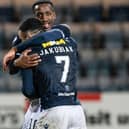 Dundee's Alex Jakubiak and Zach Robinson celebrate after the 3-1 win over Ayr United on Tuesday. (Photo by Paul Devlin / SNS Group)