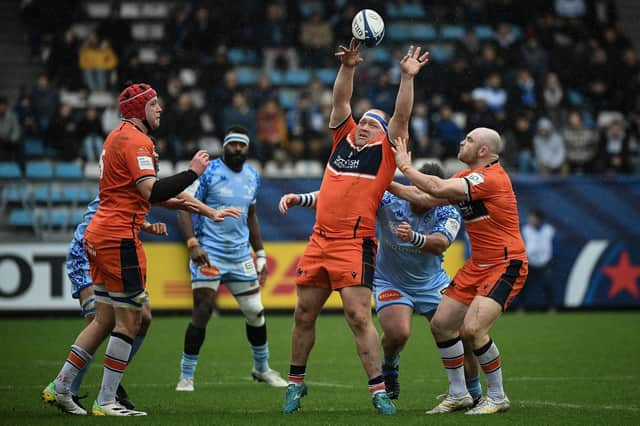Edinburgh's South African prop Luan de Bruin, second right, tries to grab the ball  during the European Rugby Champions Cup rugby union match between Castres Olympique and Edinburgh at The Pierre Fabre Stadium.
