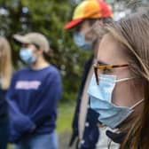 Students wearing face masks on a campus in York.