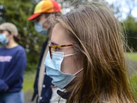 Students wearing face masks on a campus in York.