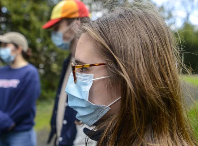 Students wearing face masks on a campus in York.