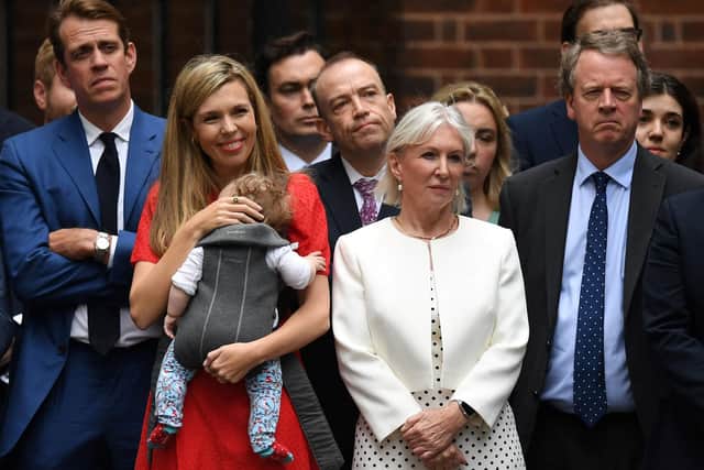 Conservative party chairman Ben Elliot, left, with Carrie Johnson, Culture Secretary Nadine Dorries, Scotland Secretary Alister Jack and others listen as Boris Johnson announces his resignation as Conservative party leader in Downing Street (Picture: Daniel Leal/AFP via Getty Images)