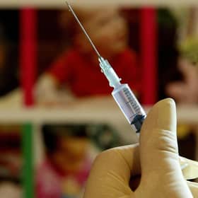 A nurse handling a syringe at a medical centre.
