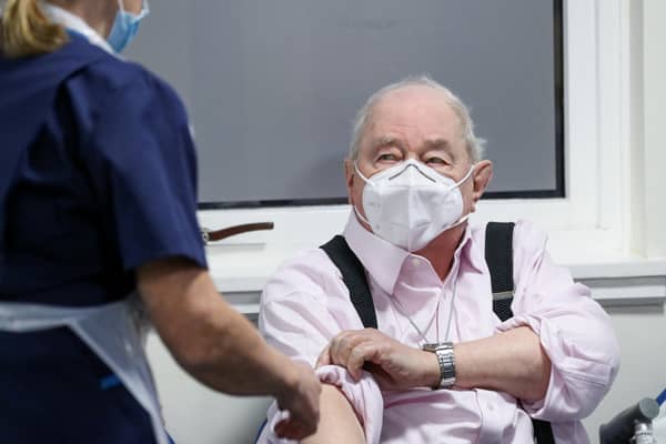 Ian Cormack preparing to receive the Oxford/AstraZeneca coronavirus vaccine at Pentlands Medical Centre in Edinburgh, Scotland.