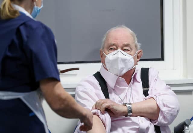 Ian Cormack preparing to receive the Oxford/AstraZeneca coronavirus vaccine at Pentlands Medical Centre in Edinburgh, Scotland.