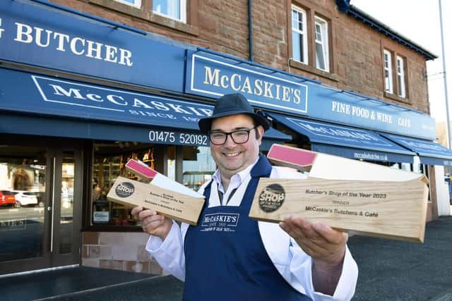 Mr Ovens standing outside McCaskie's Butchers in Wymess Bay.