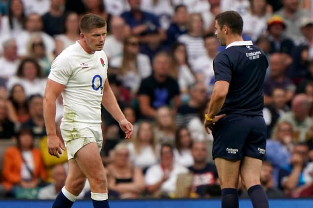 England's Owen Farrell is called over by referee Nika Amashukeli to be shown a yellow card, which was later upgraded to a red card by the TMO.