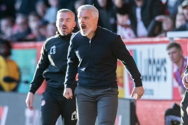 Aberdeen manager Jim Goodwin roars from the touchline during the 2-0 win over Hearts.