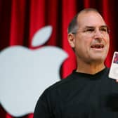 The late Apple guru Steve Jobs with his iPhone, a jukebox in the pocket (Picture: Paul Sakuma/AP/Shutterstock)