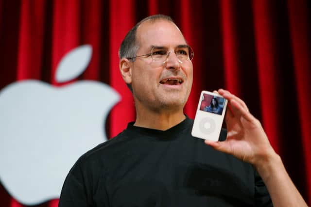 The late Apple guru Steve Jobs with his iPhone, a jukebox in the pocket (Picture: Paul Sakuma/AP/Shutterstock)