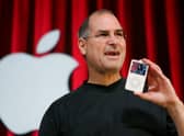 The late Apple guru Steve Jobs with his iPhone, a jukebox in the pocket (Picture: Paul Sakuma/AP/Shutterstock)