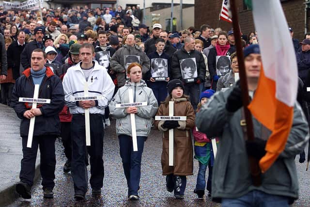 People carry crosses as thousands participate in the Bloody Sunday memorial march in 2002. Picture: BWP Media/Getty Images