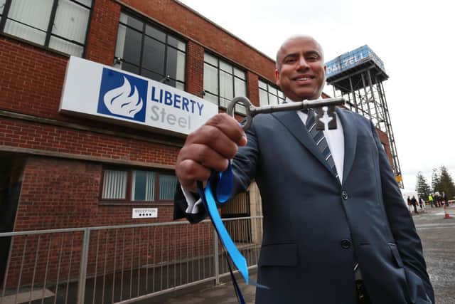 GFG's Sanjeev Gupta receives the keys to the Dalzell plant in 2016. The firm still owes £7m to Scottish Enterprise. Picture: Stewart Attwood
