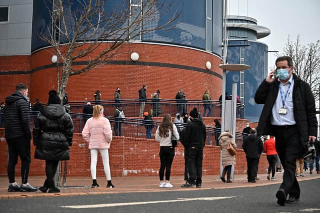 Members of the public queue to receive a Covid-19 vaccine outside Hampden Park which is being used as a mass vaccination facility. Picture: Jeff J Mitchell/Getty Images