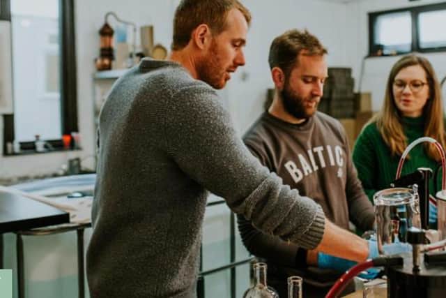 Jonny Ingledew (left) and Kate MacDonald (right) at work at North Harris Distillery where they make their award-winning gin with small batch whisky coming soon. PIC: Contributed.