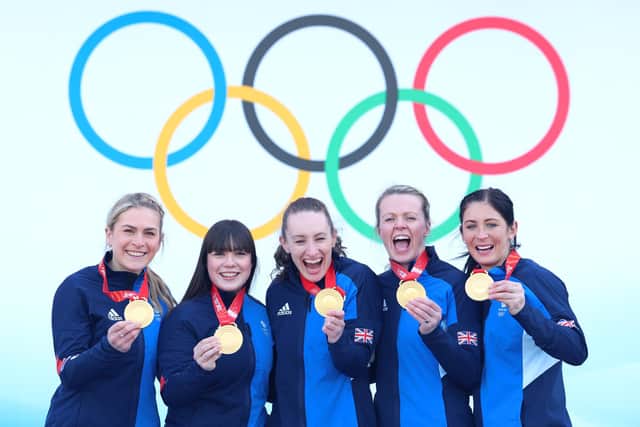 Team GB curlers Milli Smith, Hailey Duff, Jennifer Dodds, Vicky Wright and Eve Muirhead pose with their gold medals after winning the Women's Curling final against Team Japan  at the Beijing Olympics. (Photo by Lintao Zhang/Getty Images)