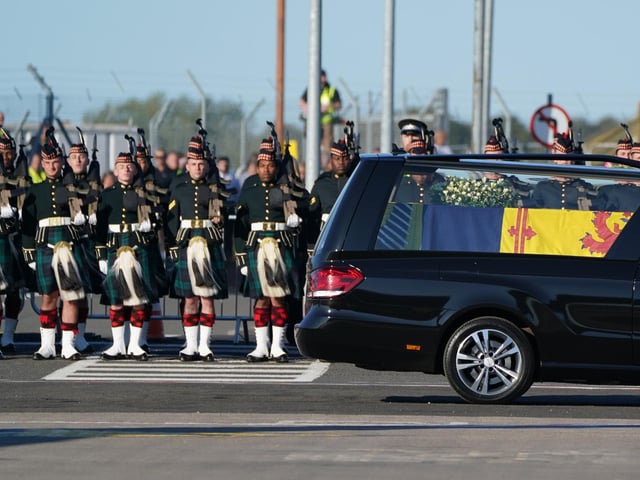 The coffin of Queen Elizabeth II at Edinburgh Airport from where it was flown by the RAF on its journey from Edinburgh to Buckingham Palace, London, to lie at rest.