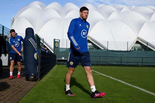 Scott McKenna strides purposefully onto the training pitch at Oriam in Edinburgh on Wednesday as Scotland prepare for their crucial World Cup qualifier against Israel at Hampden. (Photo by Craig Williamson / SNS Group)