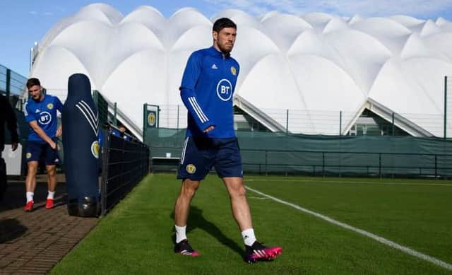 Scott McKenna strides purposefully onto the training pitch at Oriam in Edinburgh on Wednesday as Scotland prepare for their crucial World Cup qualifier against Israel at Hampden. (Photo by Craig Williamson / SNS Group)