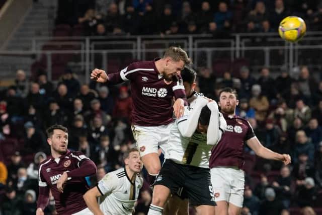 Hearts' Stephen Kingsley scores his header at Tynecastle. (Photo by Ross Parker / SNS Group)
