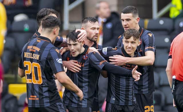 Dundee United's Dylan Levitt celebrates as he makes it 1-0 against Motherwell.