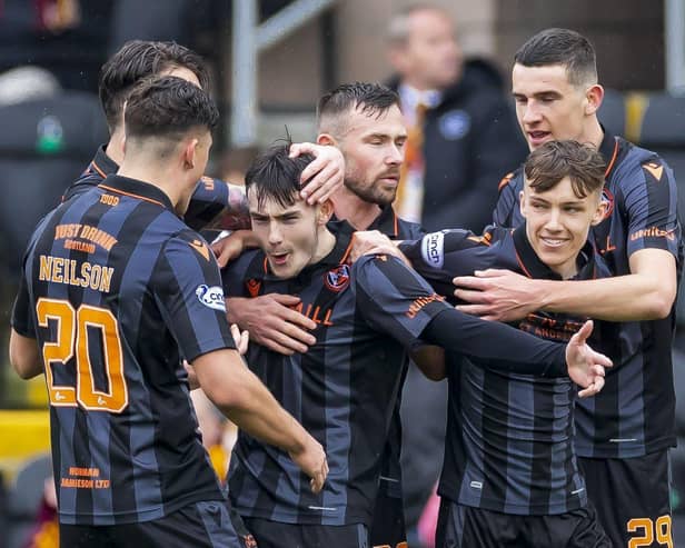 Dundee United's Dylan Levitt celebrates as he makes it 1-0 against Motherwell.