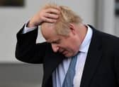Prime Minister Boris Johnson prepares to speak with members of the media during a visit to Warszawska Brygada Pancerna military base on February 10. Pucture: Daniel Leal/Getty Images